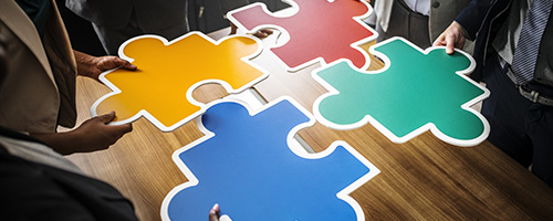 People playing with a giant puzzle