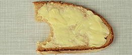 Some butter on a piece of bread